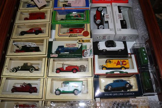 52 Corgi, Lledo and other models, inc trade and transport vehicles in two glazed wall display cases